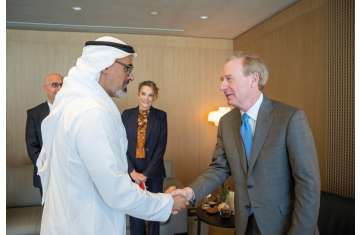 Khaled bin Mohamed bin Zayed and Brad Smith