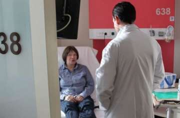 An oncologist consults with a cancer patient at a hospital in Lyon, France. Photo: WHO