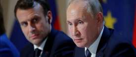 فلاديمير بوتن وإيمانويل ماكرون